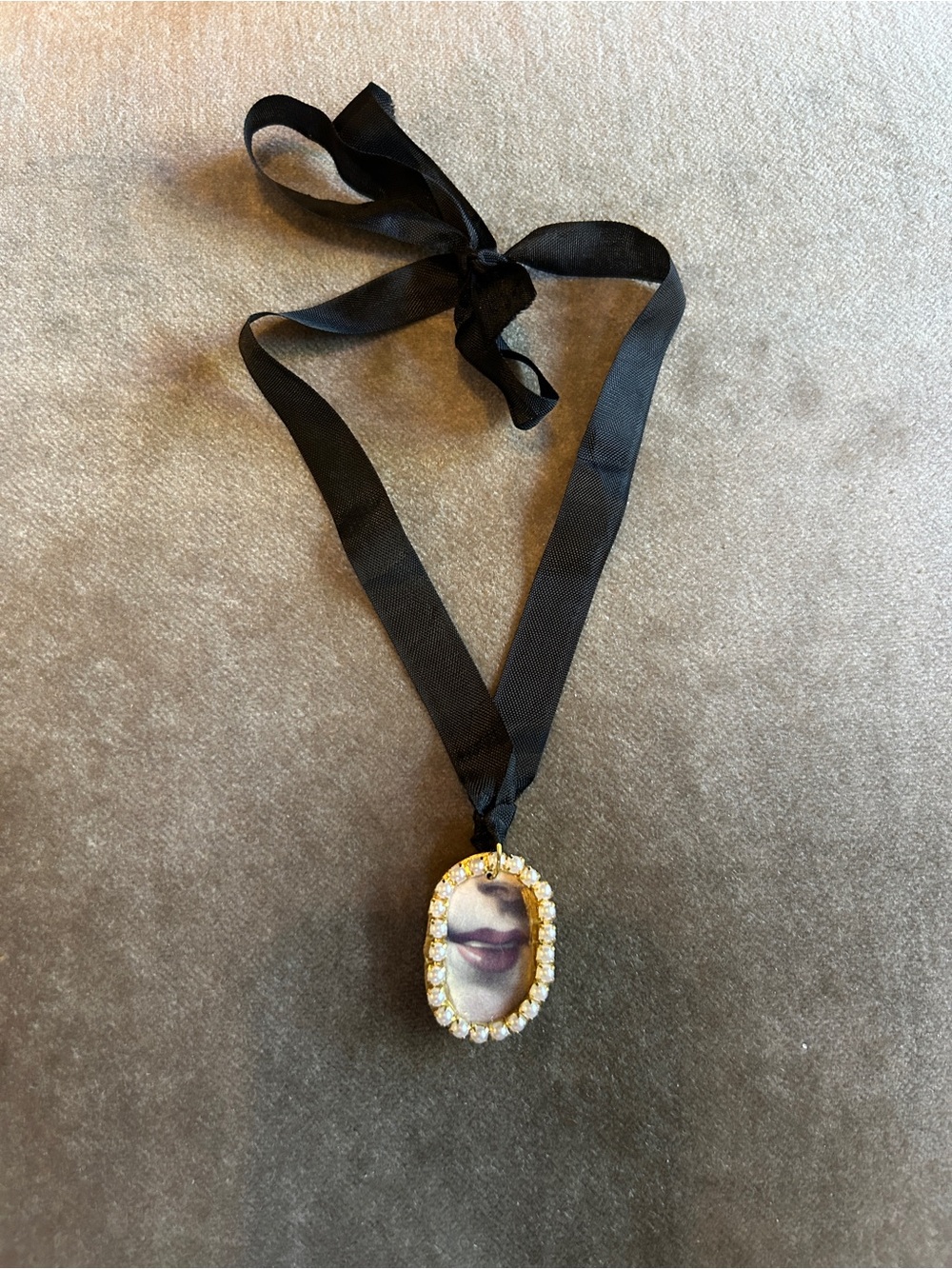 Gold-Tone Crystal Oval Lover’s Smile Pendant Necklace with Black Ribbon